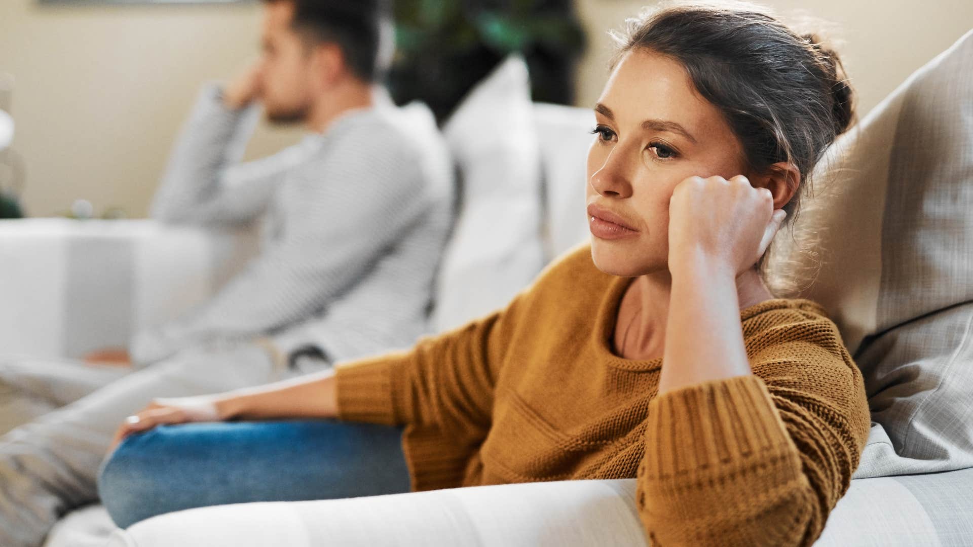 woman experiencing irritability sitting next to her partner
