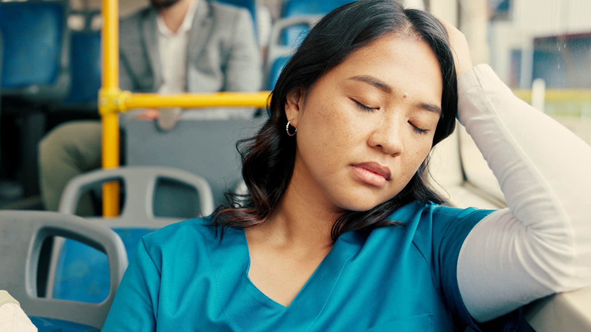 woman sleeping on a bus after missing out on morning mindfulness