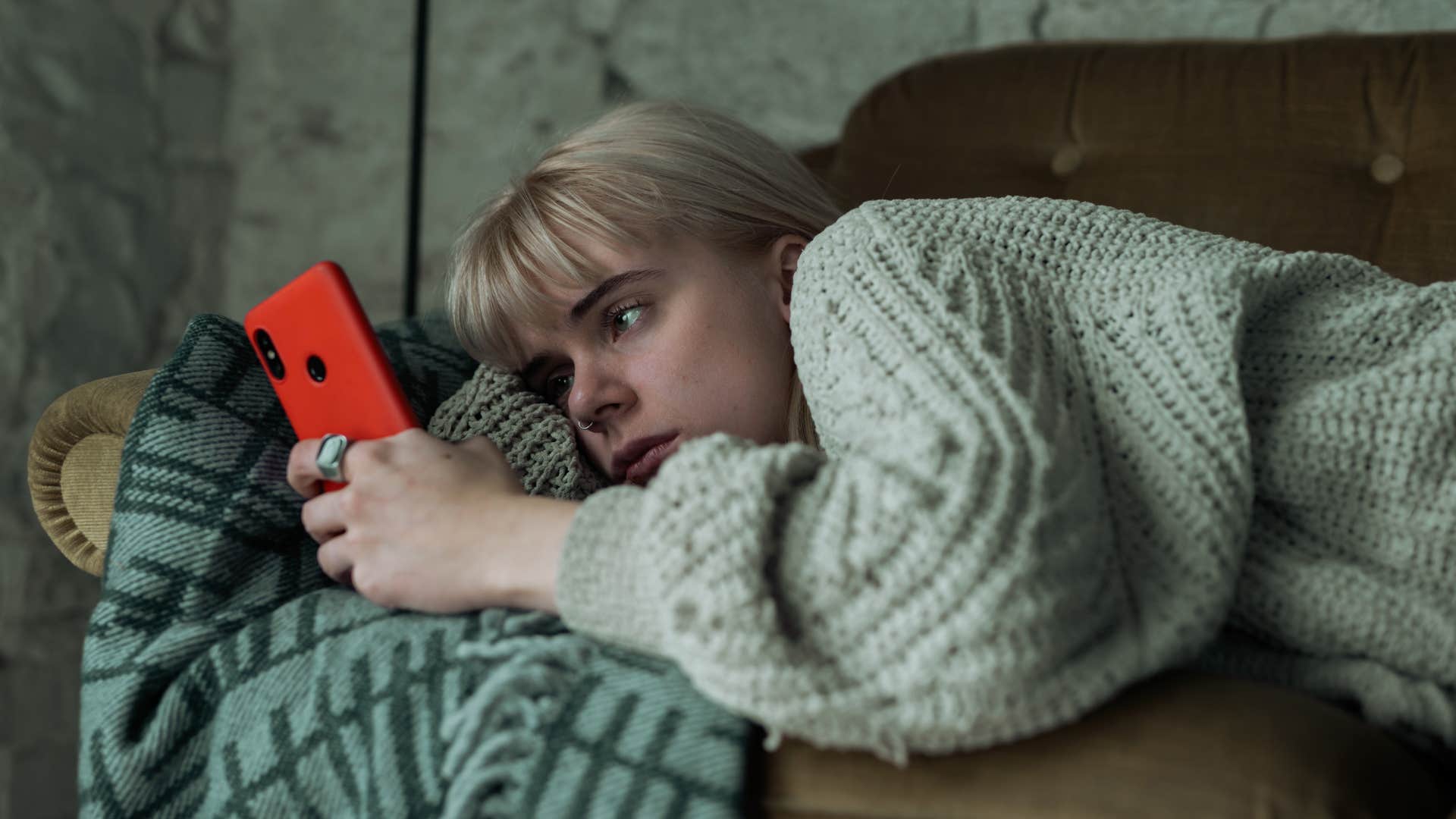 woman wasting time scrolling on her phone