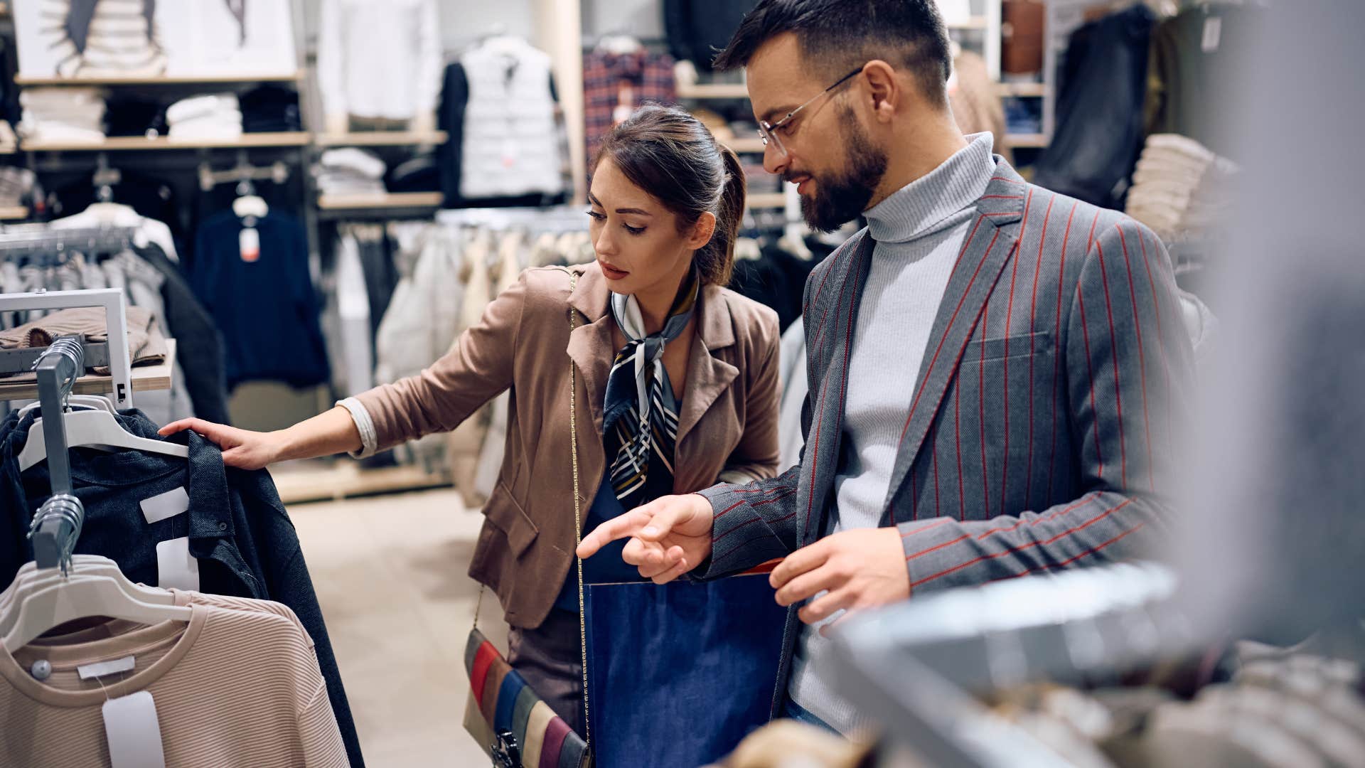 couple shopping together at clothing store