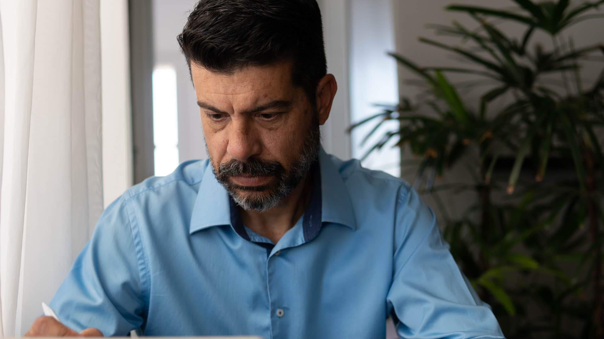 money-conscious man who avoids debt