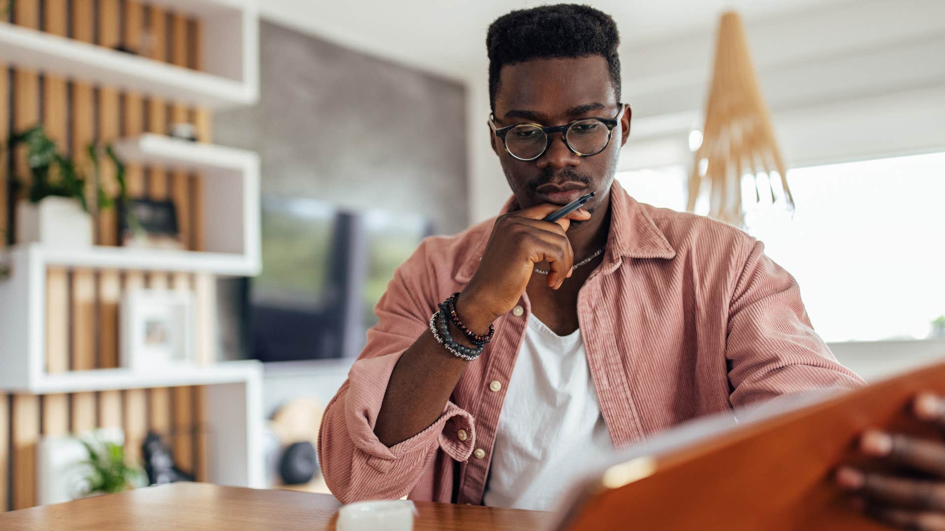 man thinking if it's not broke, don't fix it about his laptop