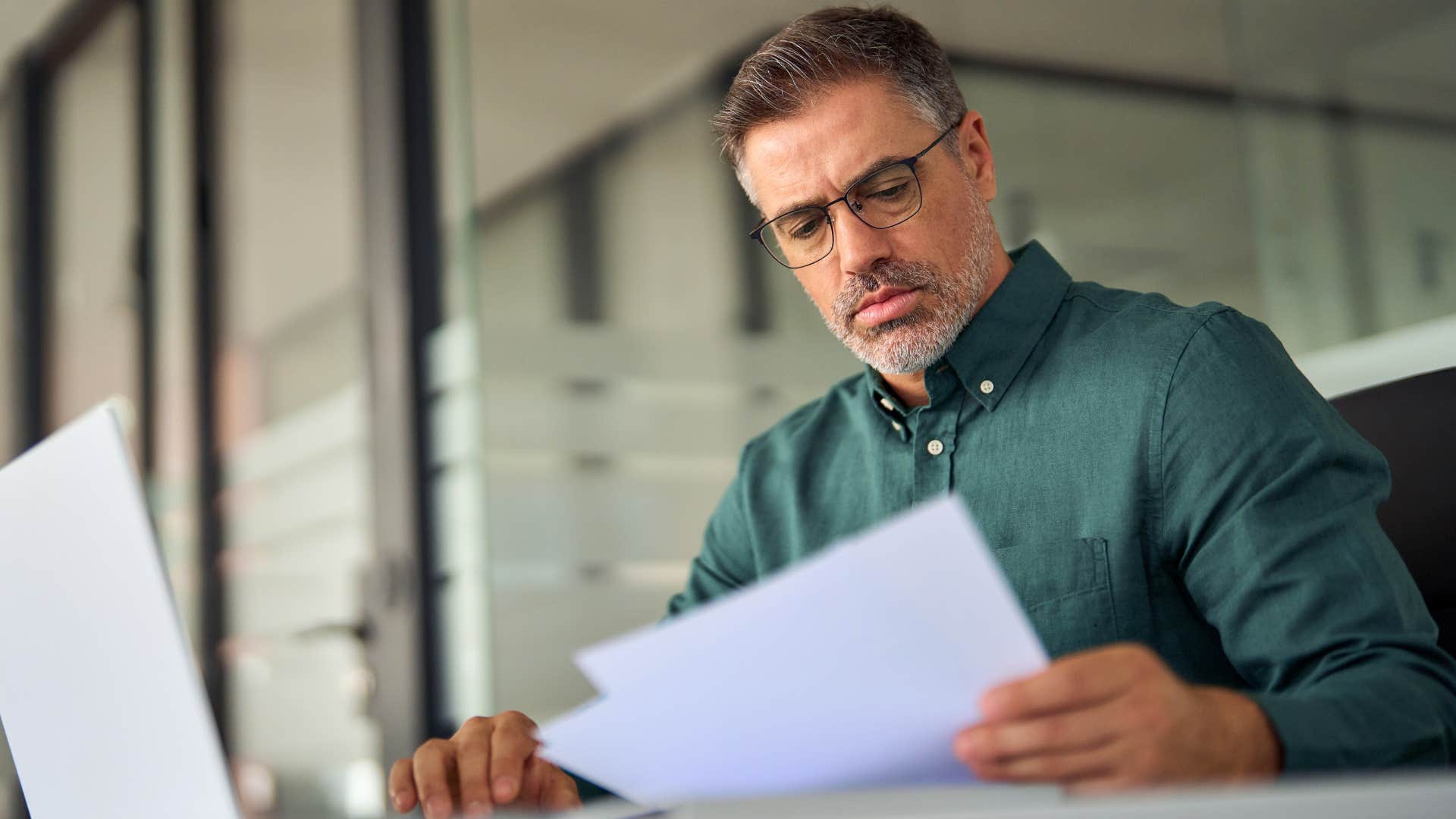 man who never relies completely on technology doing bills