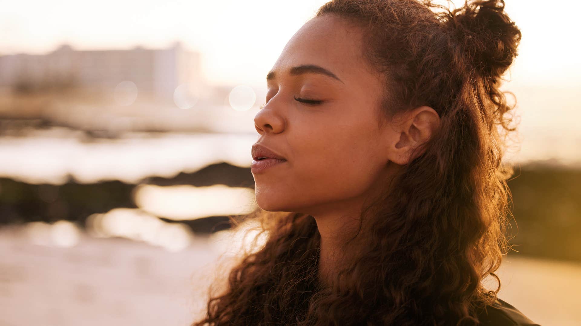 spiritual woman outside listening to her intuition