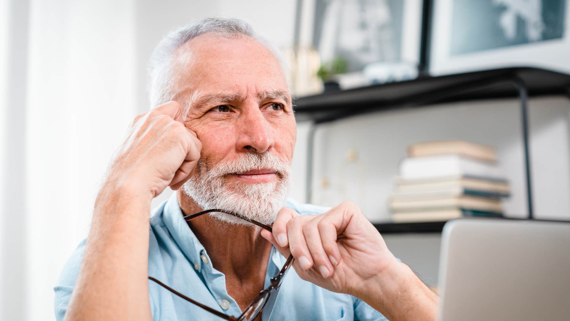 man at work thinking hard about synchronicities hes noticing