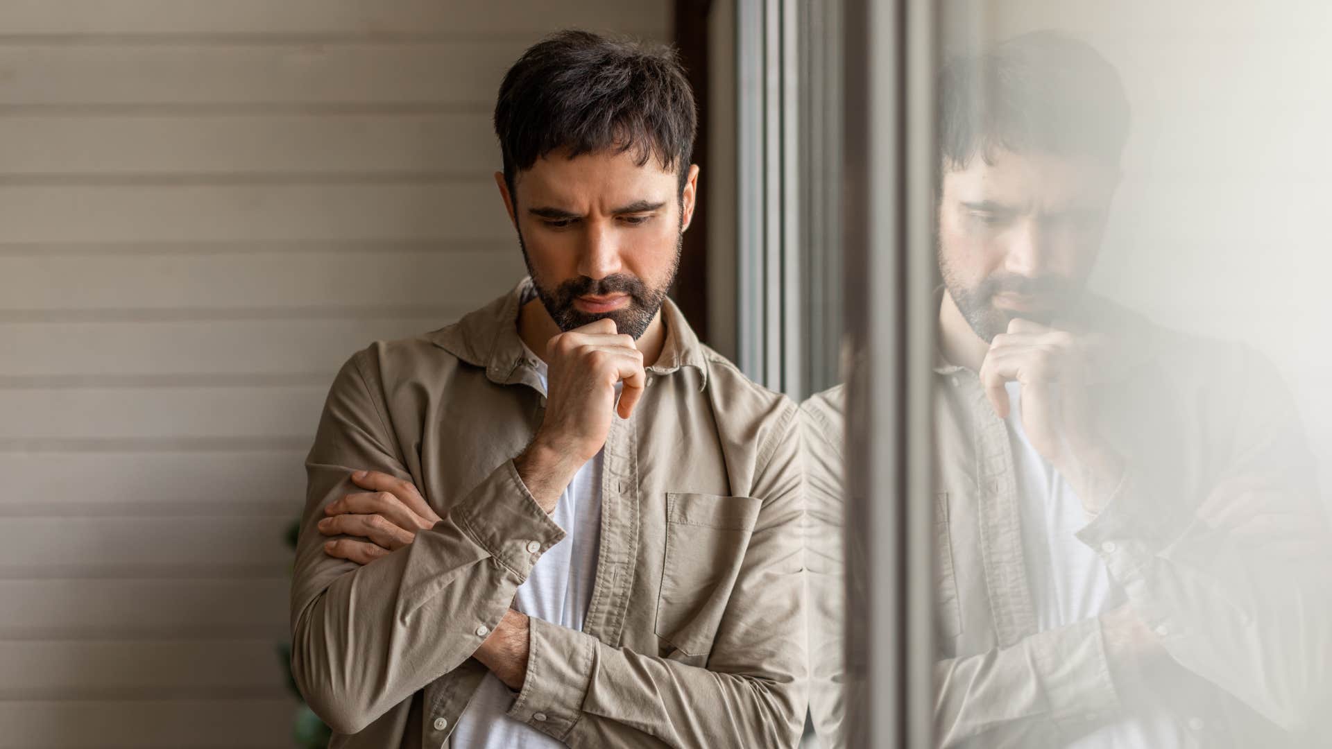 quiet man thinking by the window
