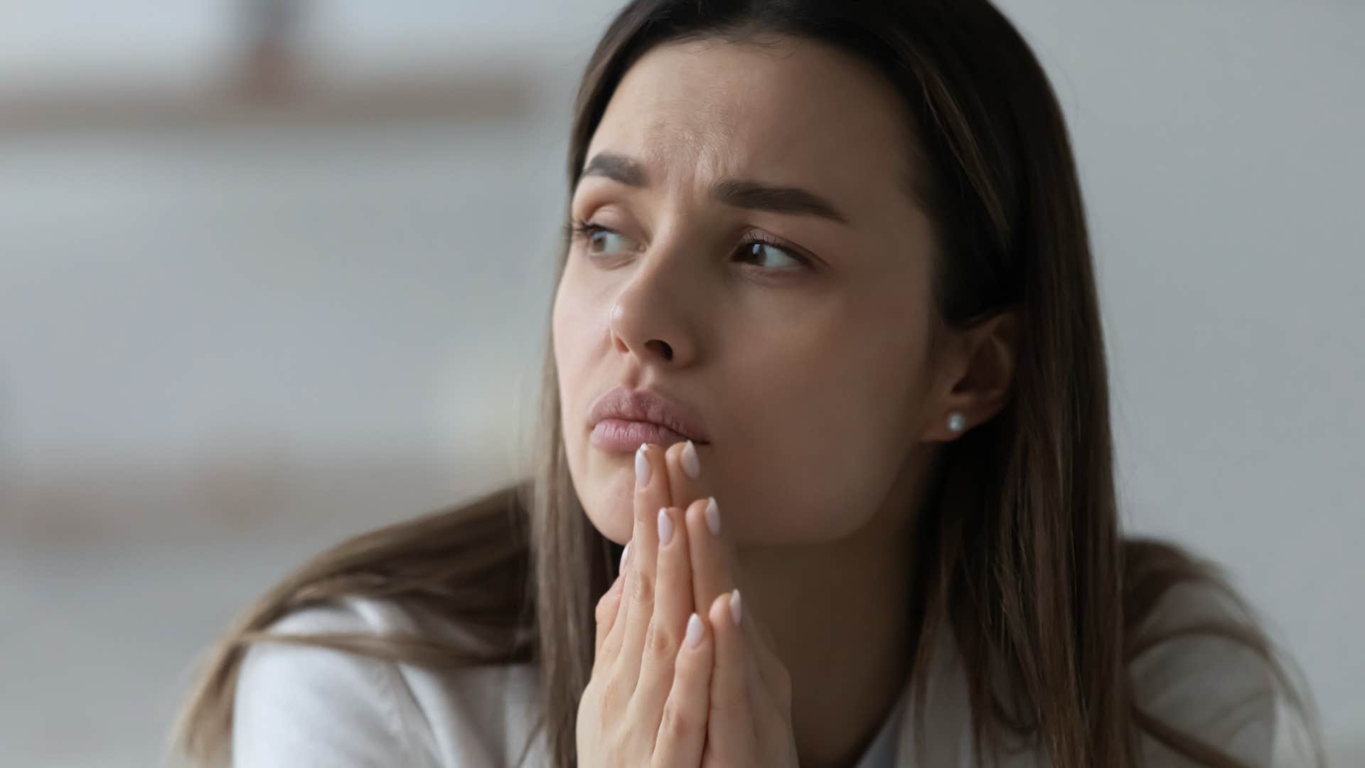 sad woman thinking about unresolved trauma