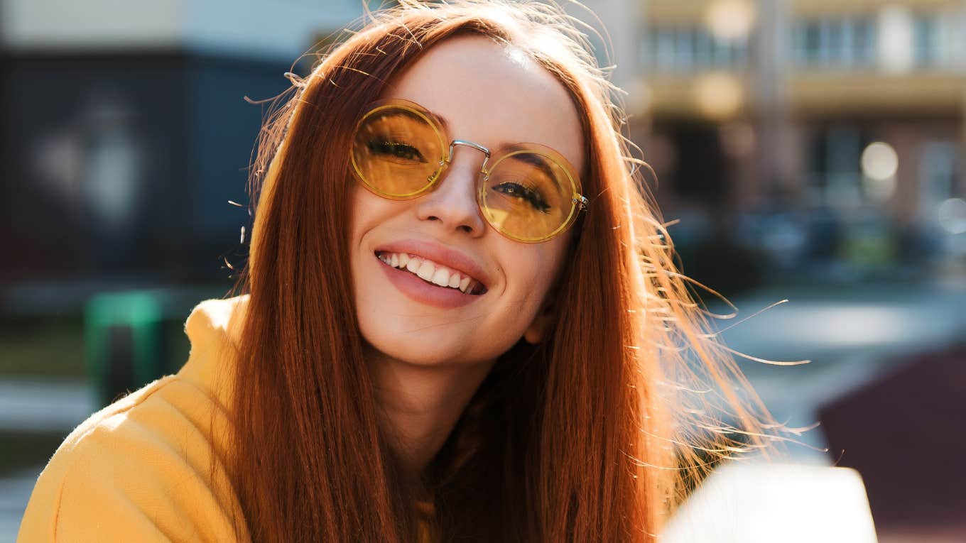 smiling young woman who thrives in chaos