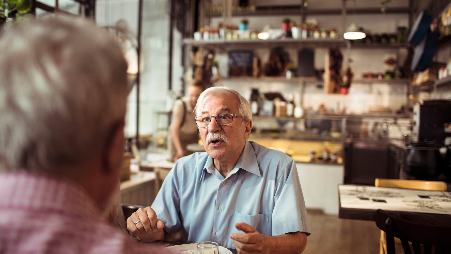 man sitting across from woman at restaurant saying no offense
