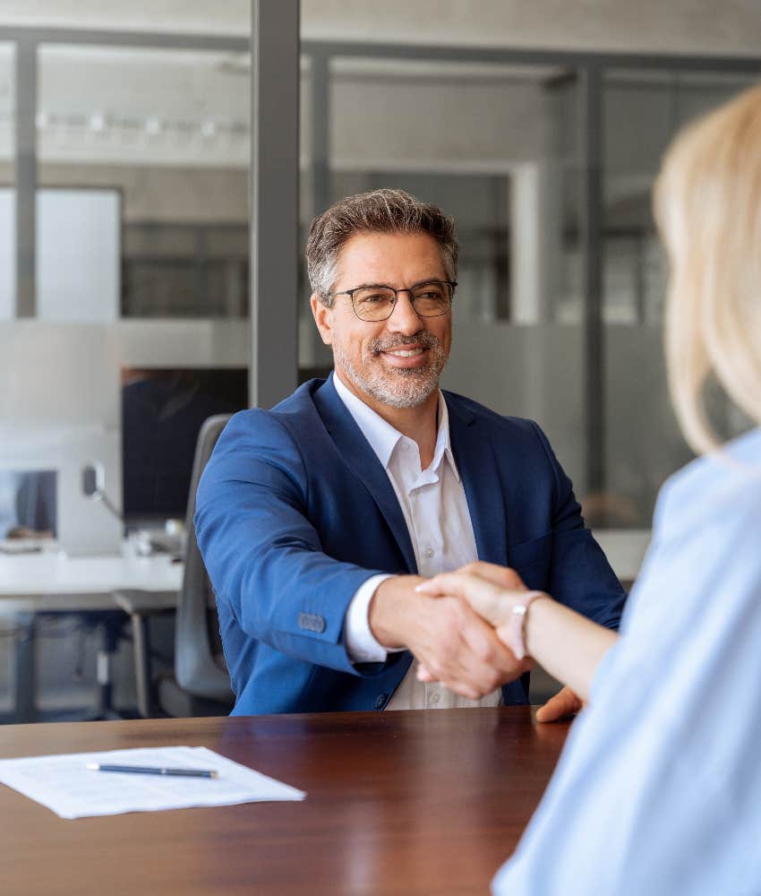 businessman shaking hands with interviewee