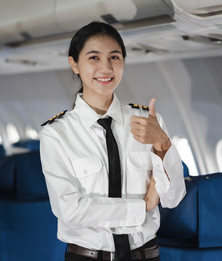 female pilot preparing plane cabin for flight
