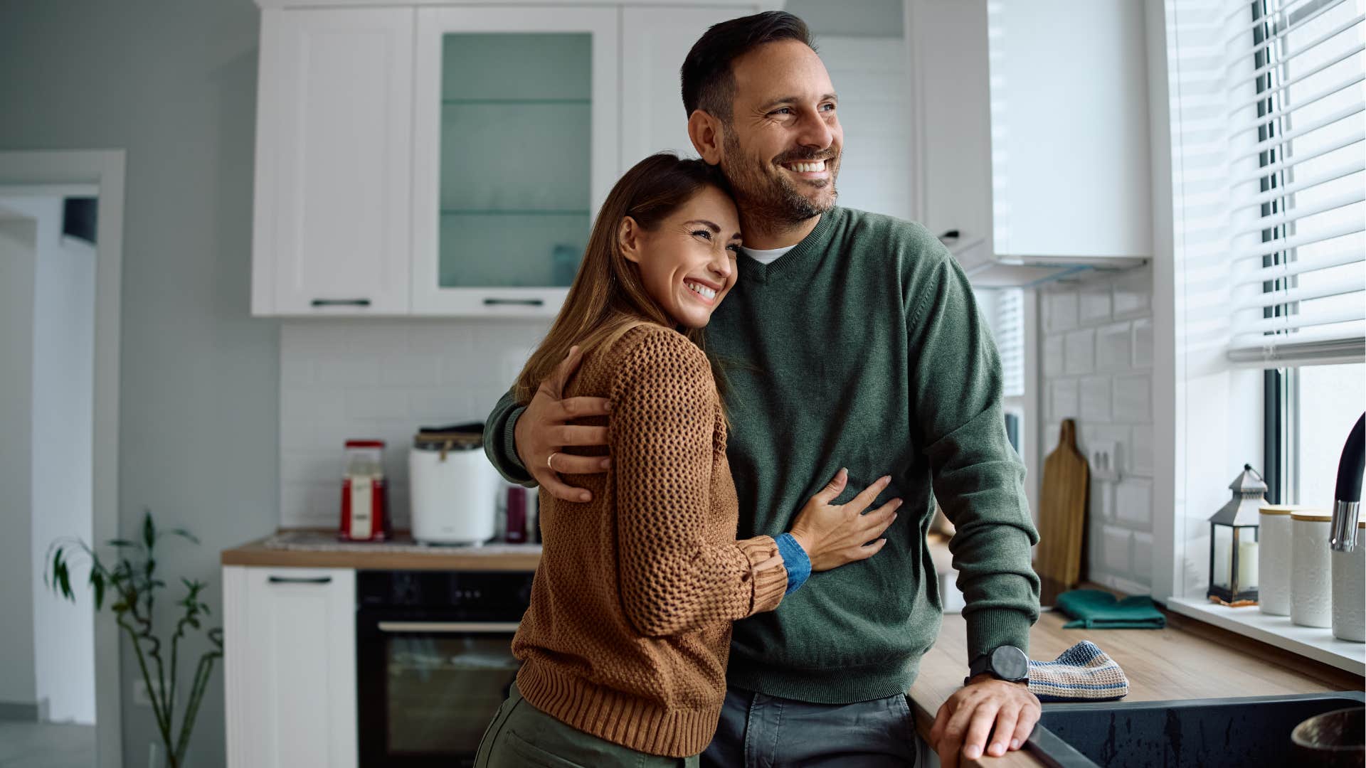 man who shows woman he's not going anywhere as he makes her feel safe