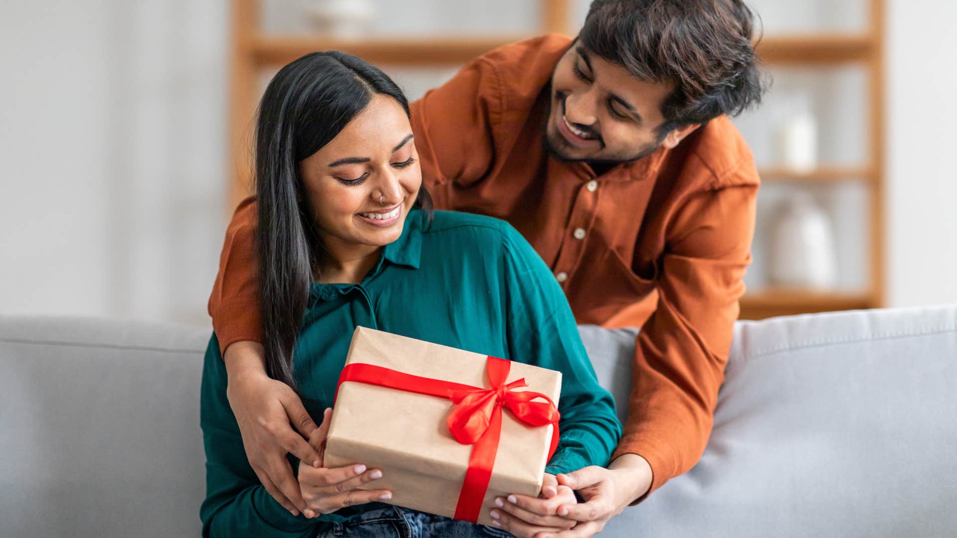 man who shows woman he's not going anywhere by putting thought into the gifts he gives her
