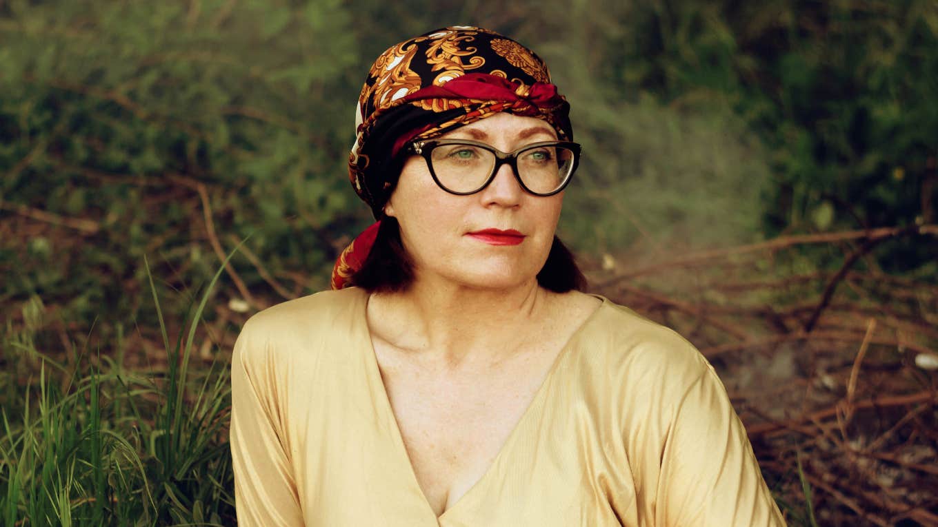 Woman looking off to the side in deep reflection, capturing the emotional regrets people feel when a marriage they believed would last forever begins to fall apart.