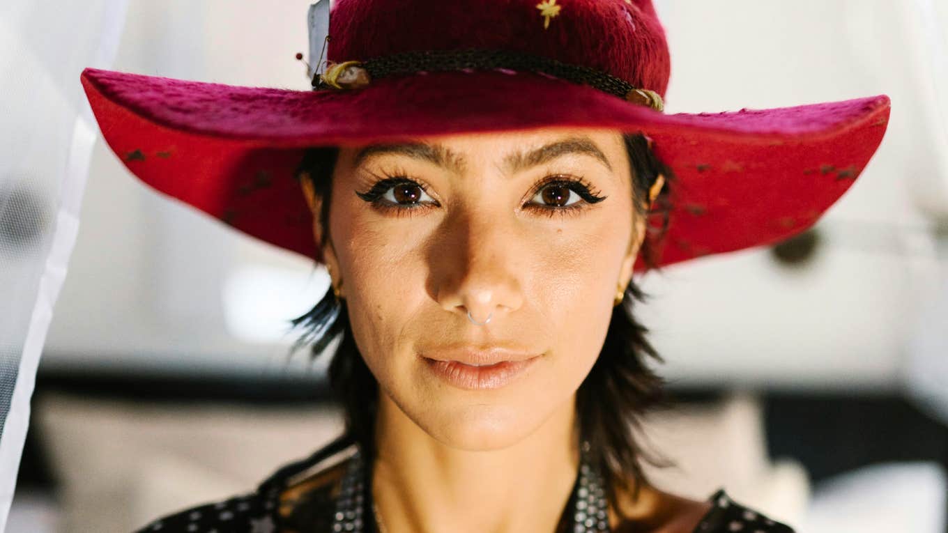 Intuitive woman with a dreamy spiritual expression showing the signs you might be a rare starseed person