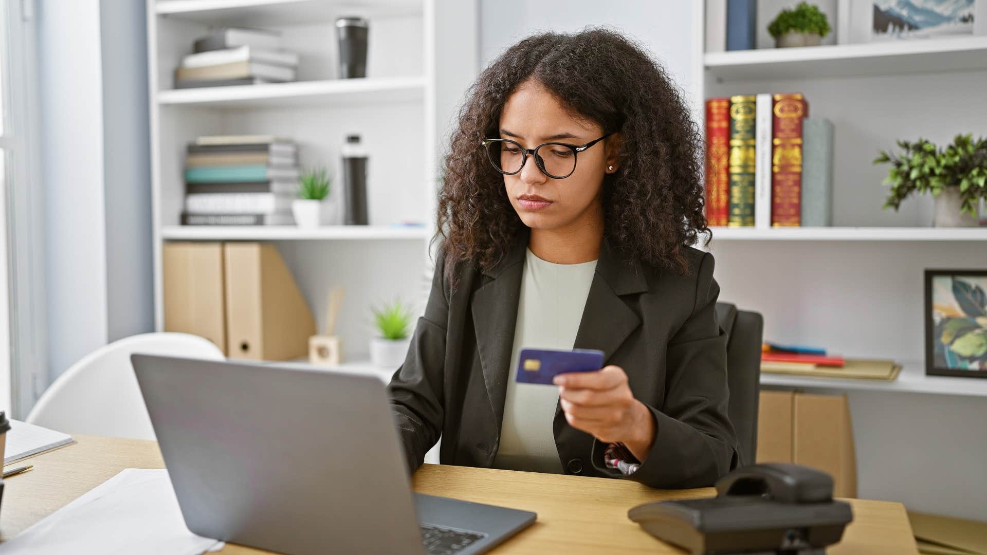 woman relying on credit cards for essentials not luxuries