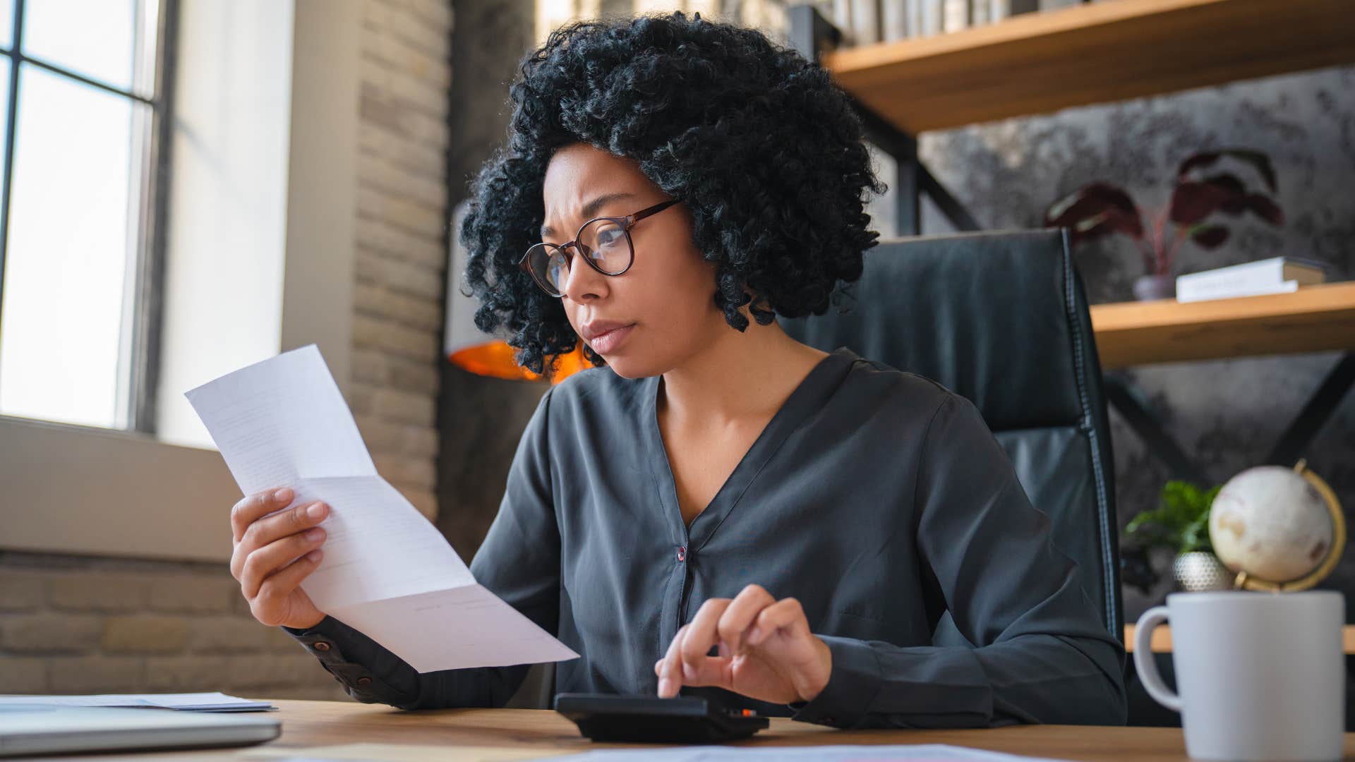 woman looking low salary that hasn't kept up with inflation