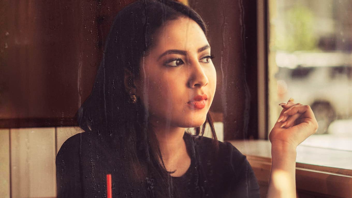 Person thinking about a message from an ex with confusion and clarity showing the signs your ex is testing you and what to do next