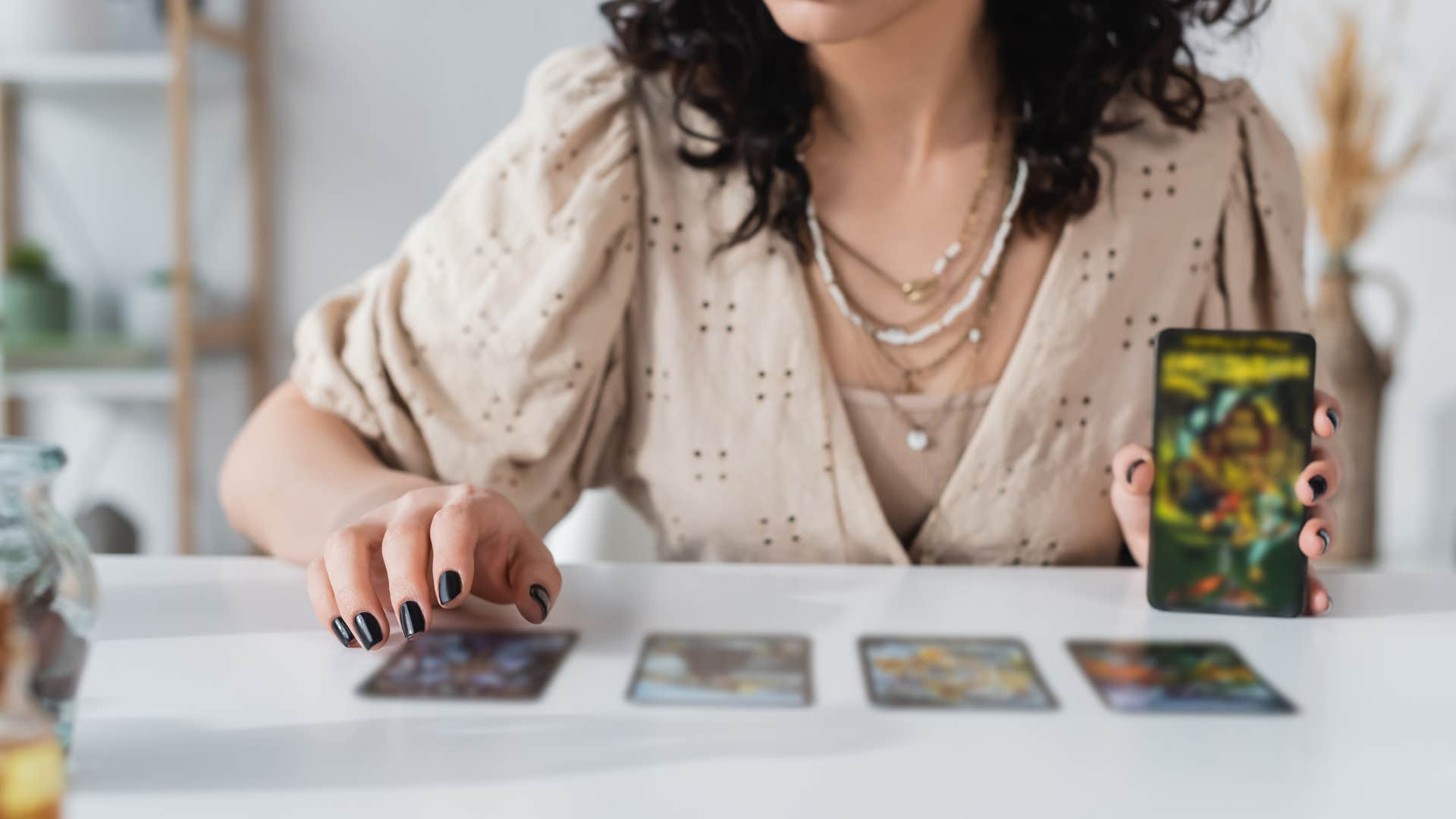 woman who is naturally intuitive as she uses oracle cards