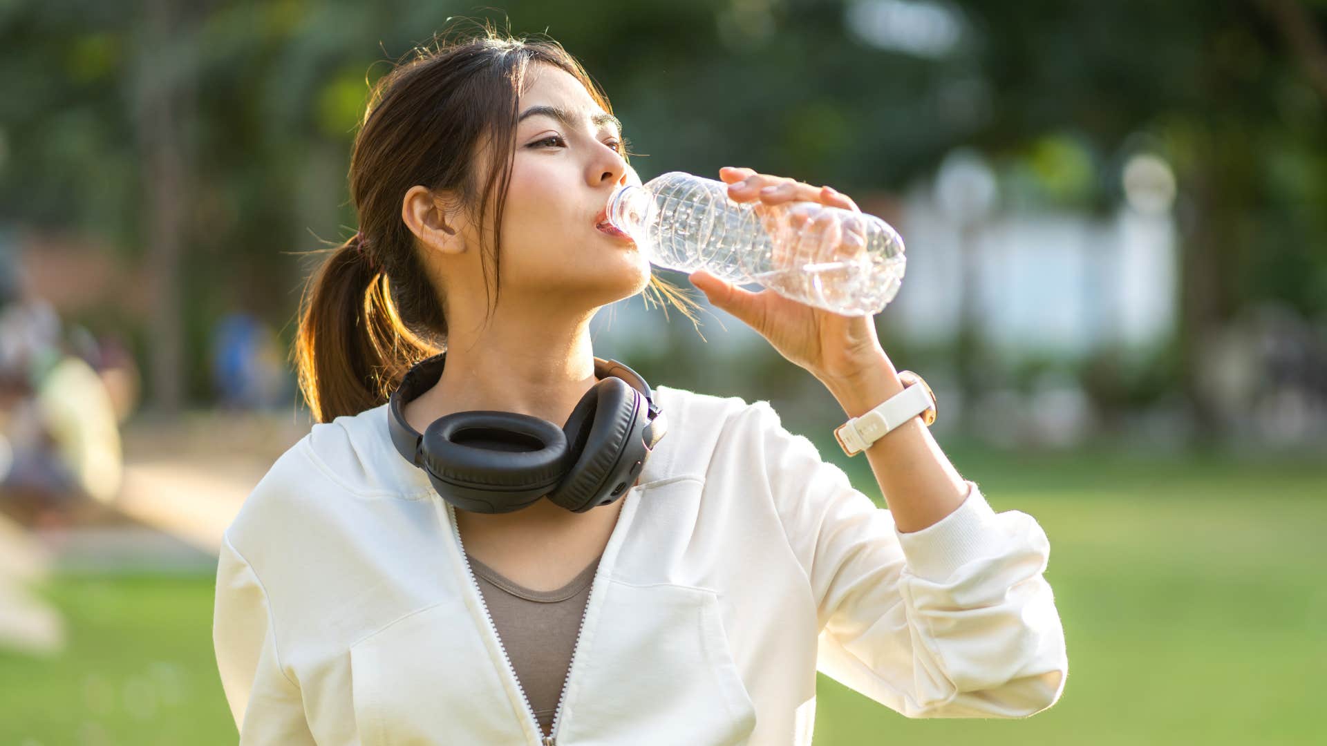 Person drinks water to feel their best