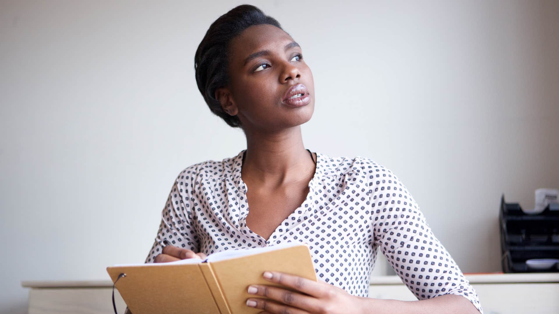 Person pens thoughts to calm anxiety