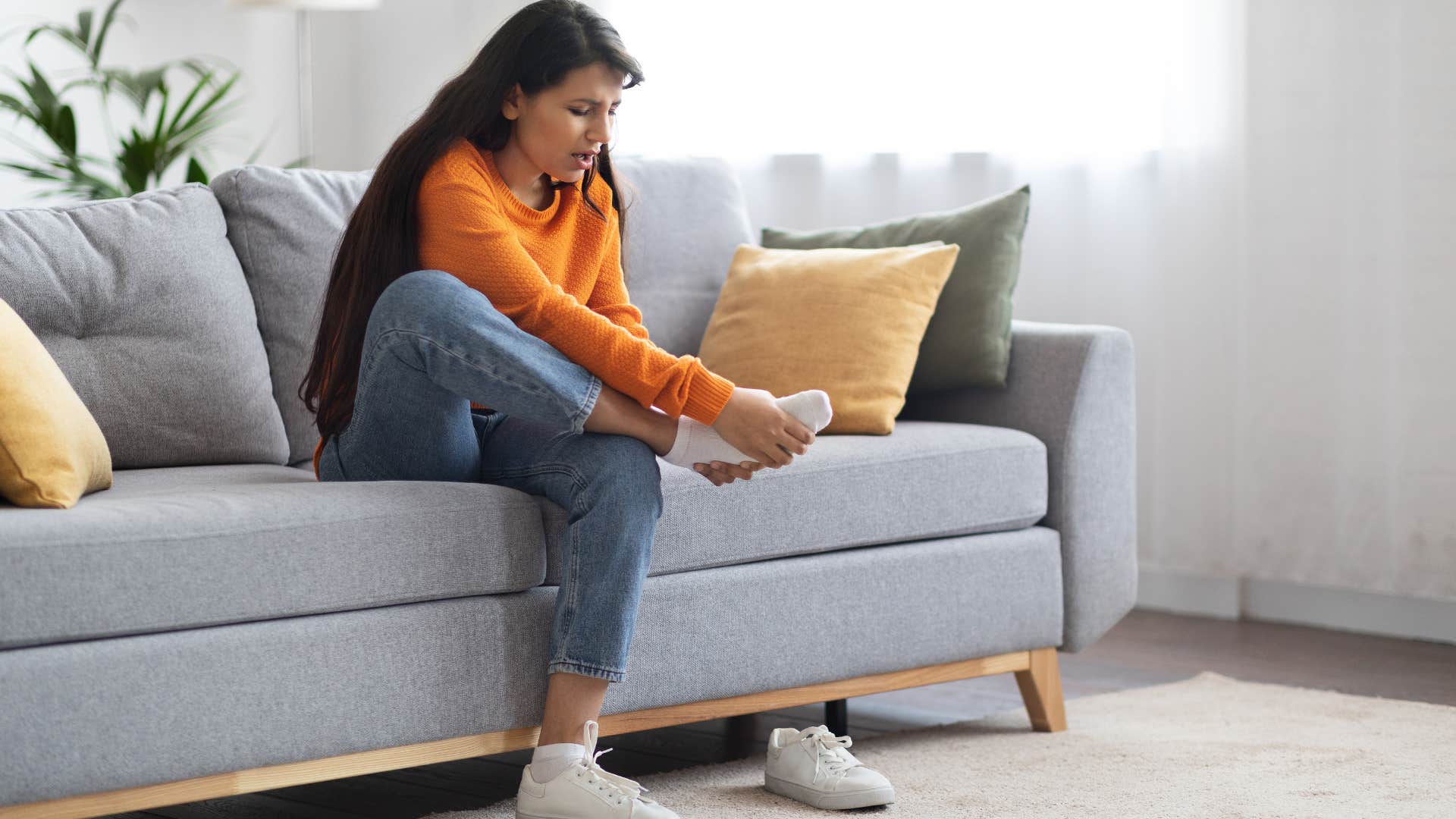 Person touches toes to calm anxiety