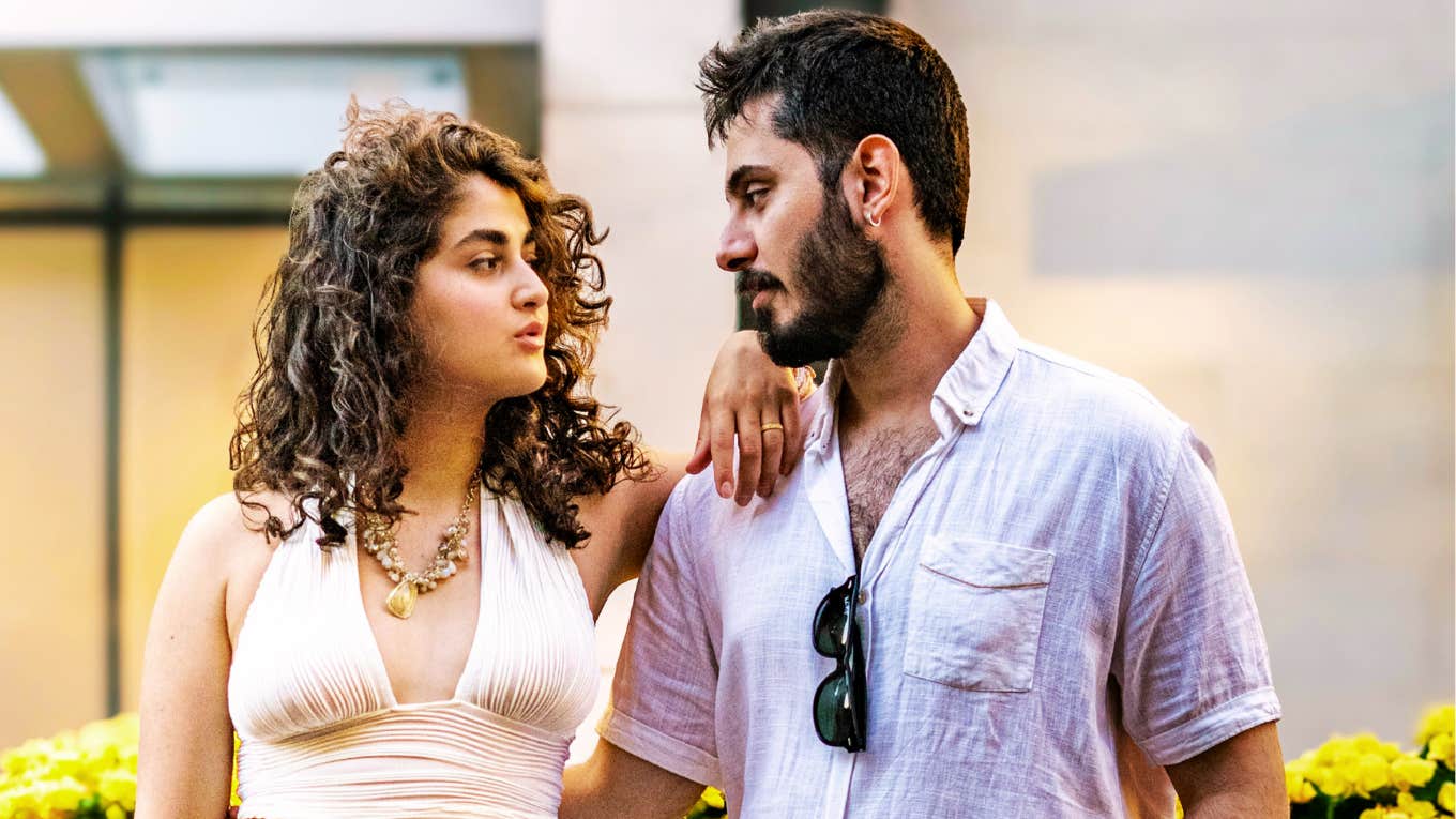 Couple looking at each other while finding a compromise showing the art of social compromise and ways extroverts can stay married to introverts.