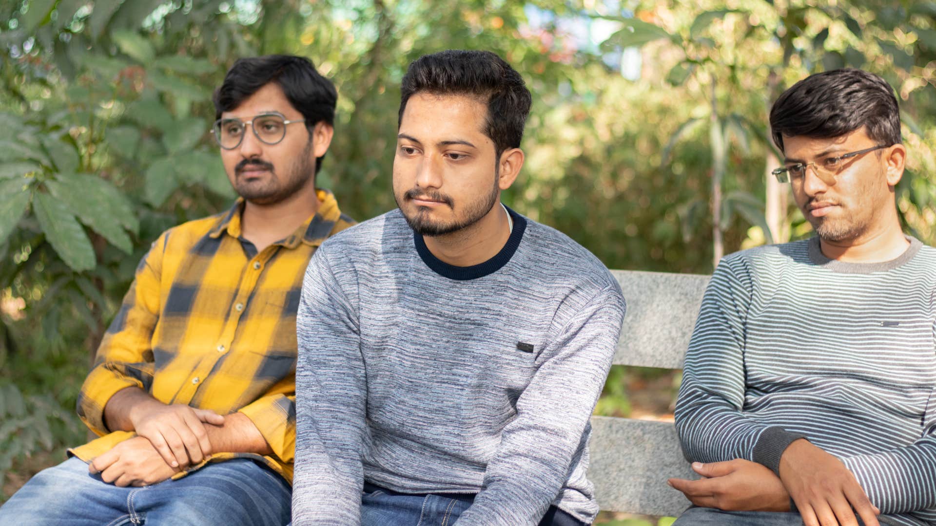 men not contributing to shared event sitting lazy