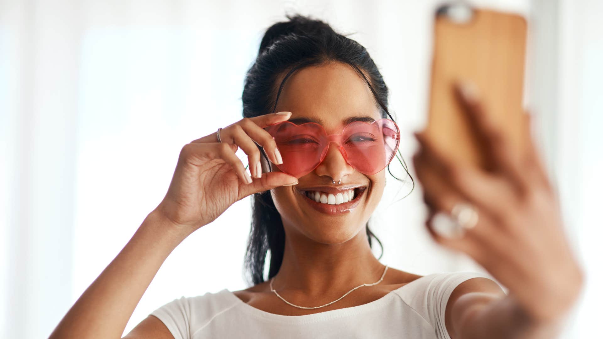 influencer taking selfie to post on social media