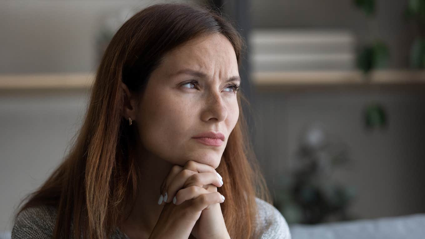 sad woman thinking while hearing background noise