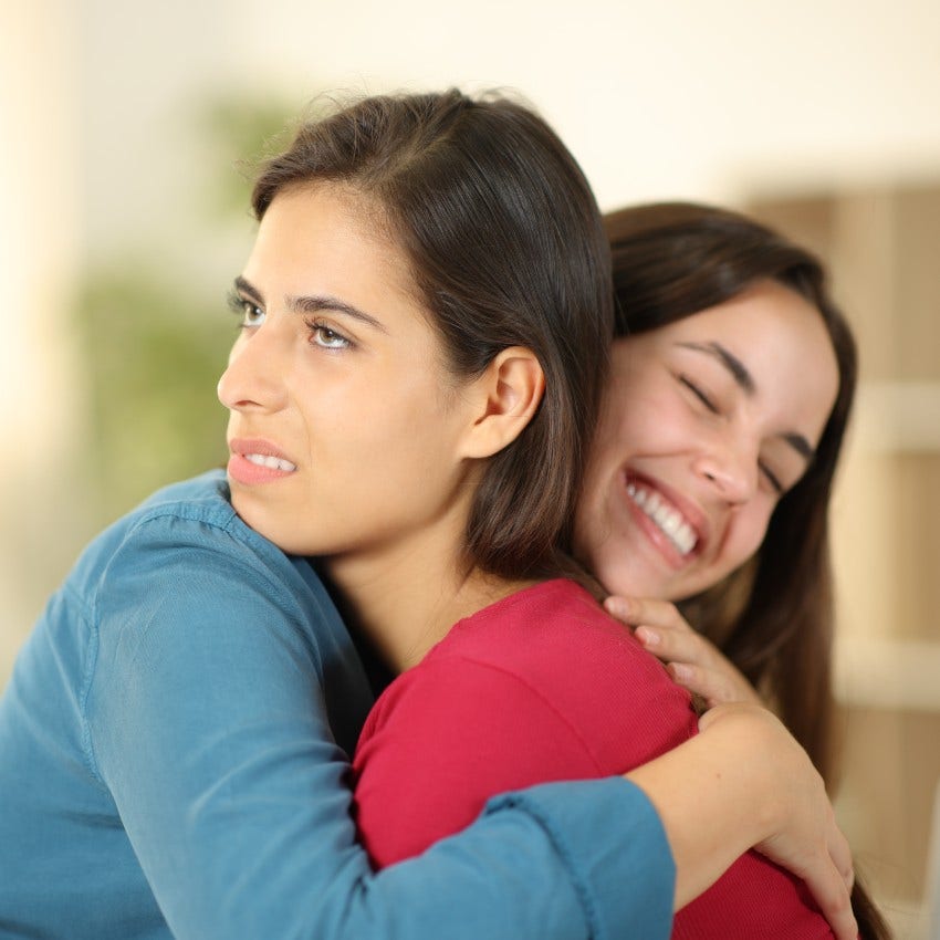 woman who secretly can't stand other woman as she isn't excited to see her