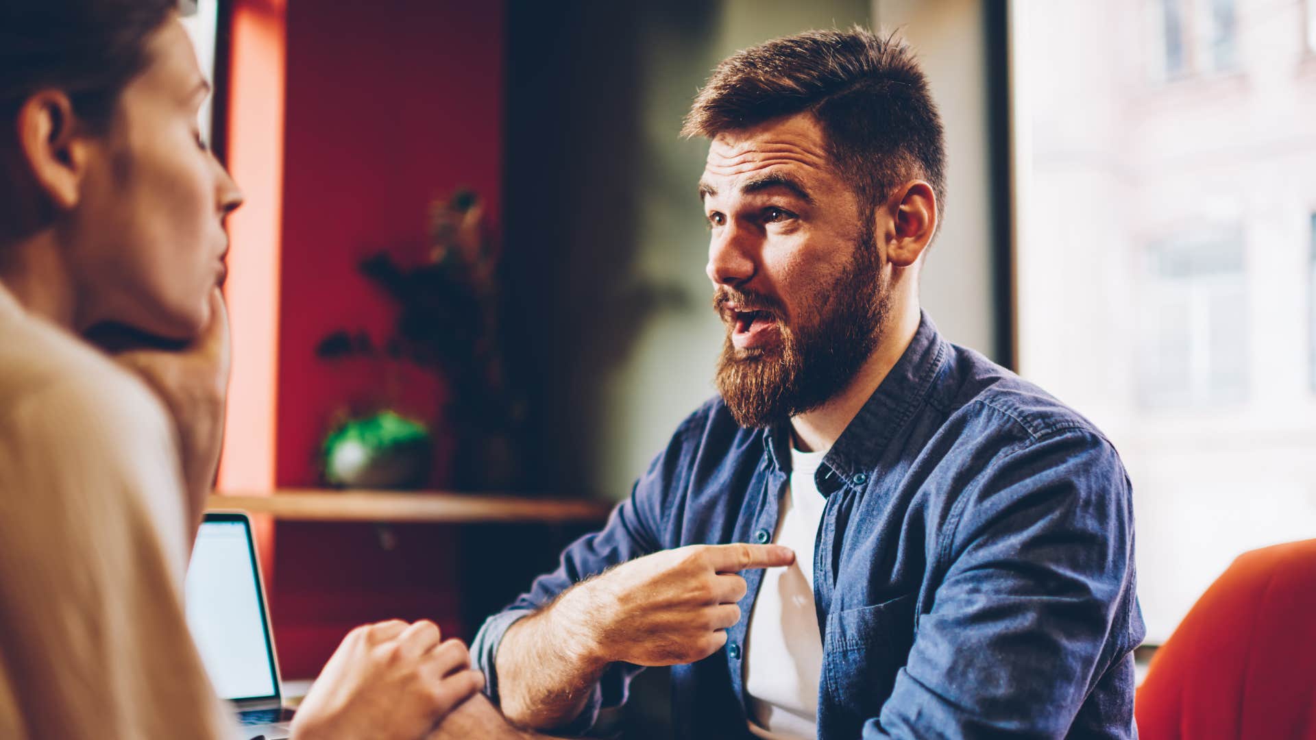 man telling partner she owes him