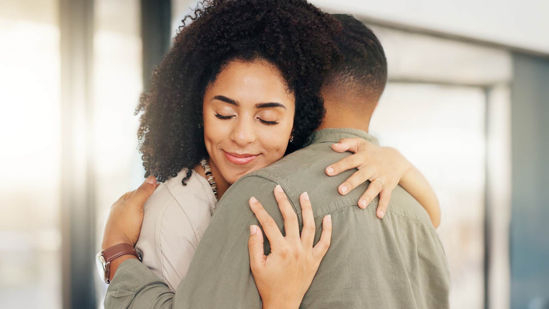 woman hugging her husband whose love feels like a soft place to land