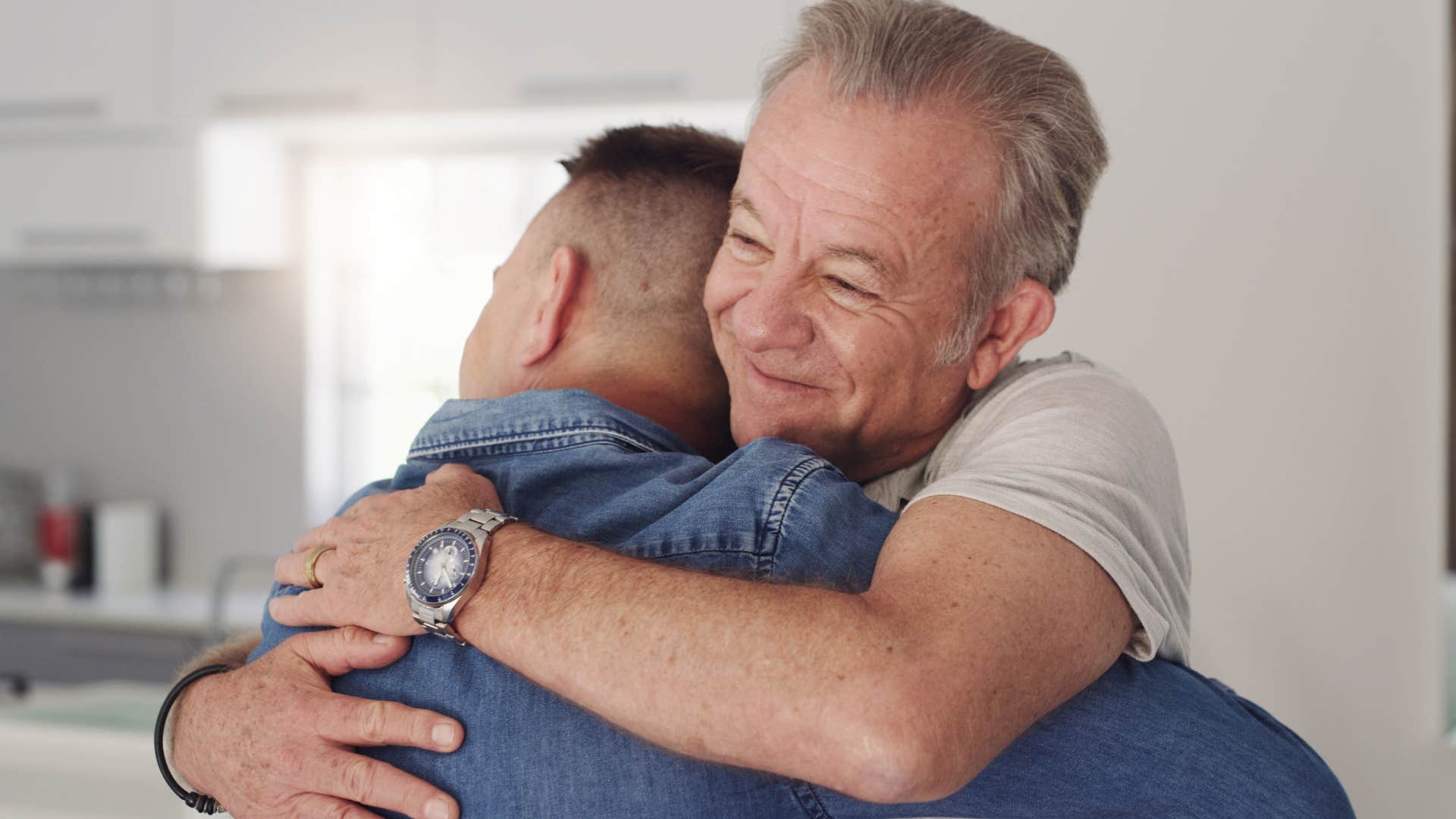 man hugging his partner when the simplest moments are the most special