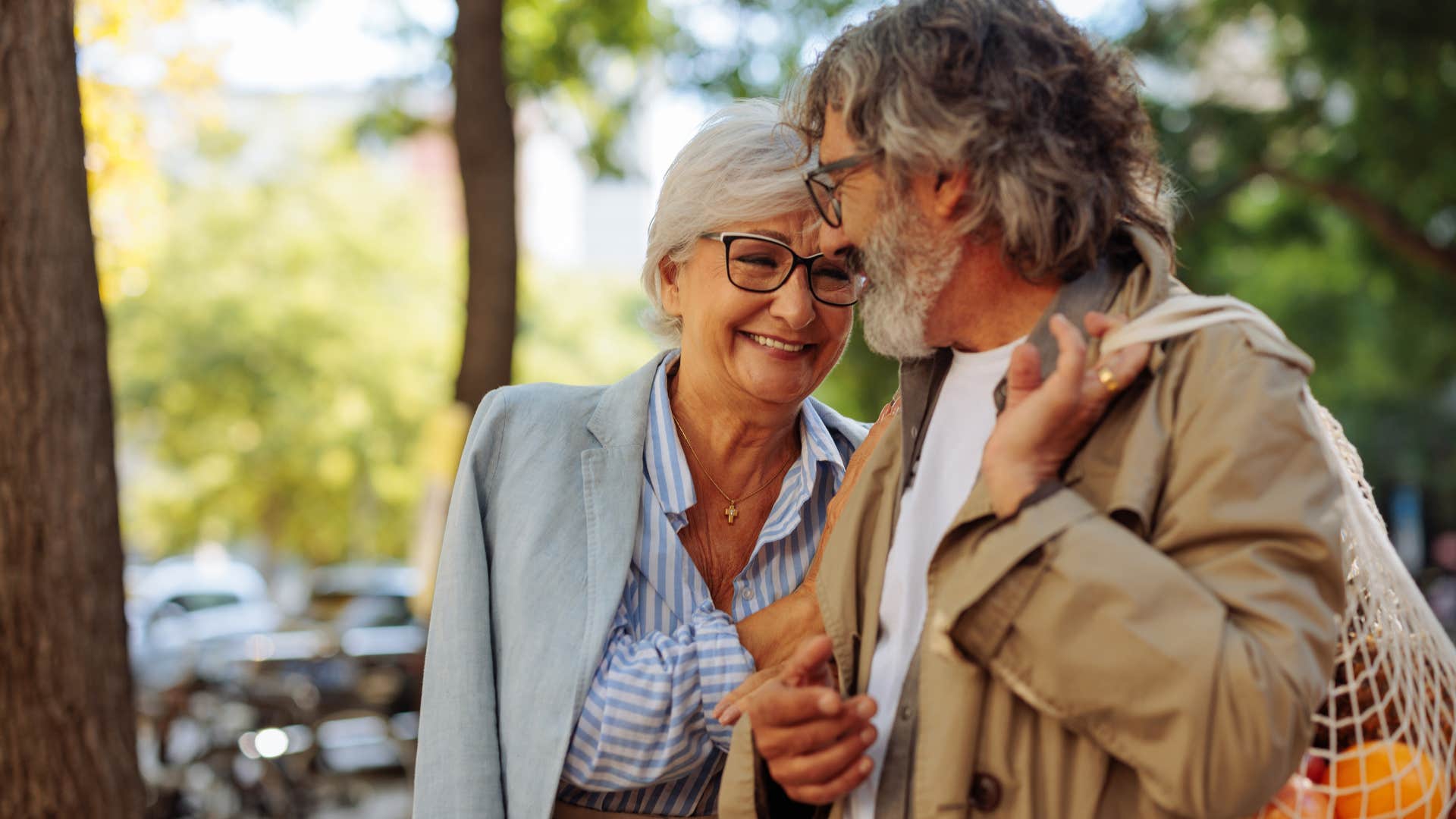 woman smiling with her partner walking outside