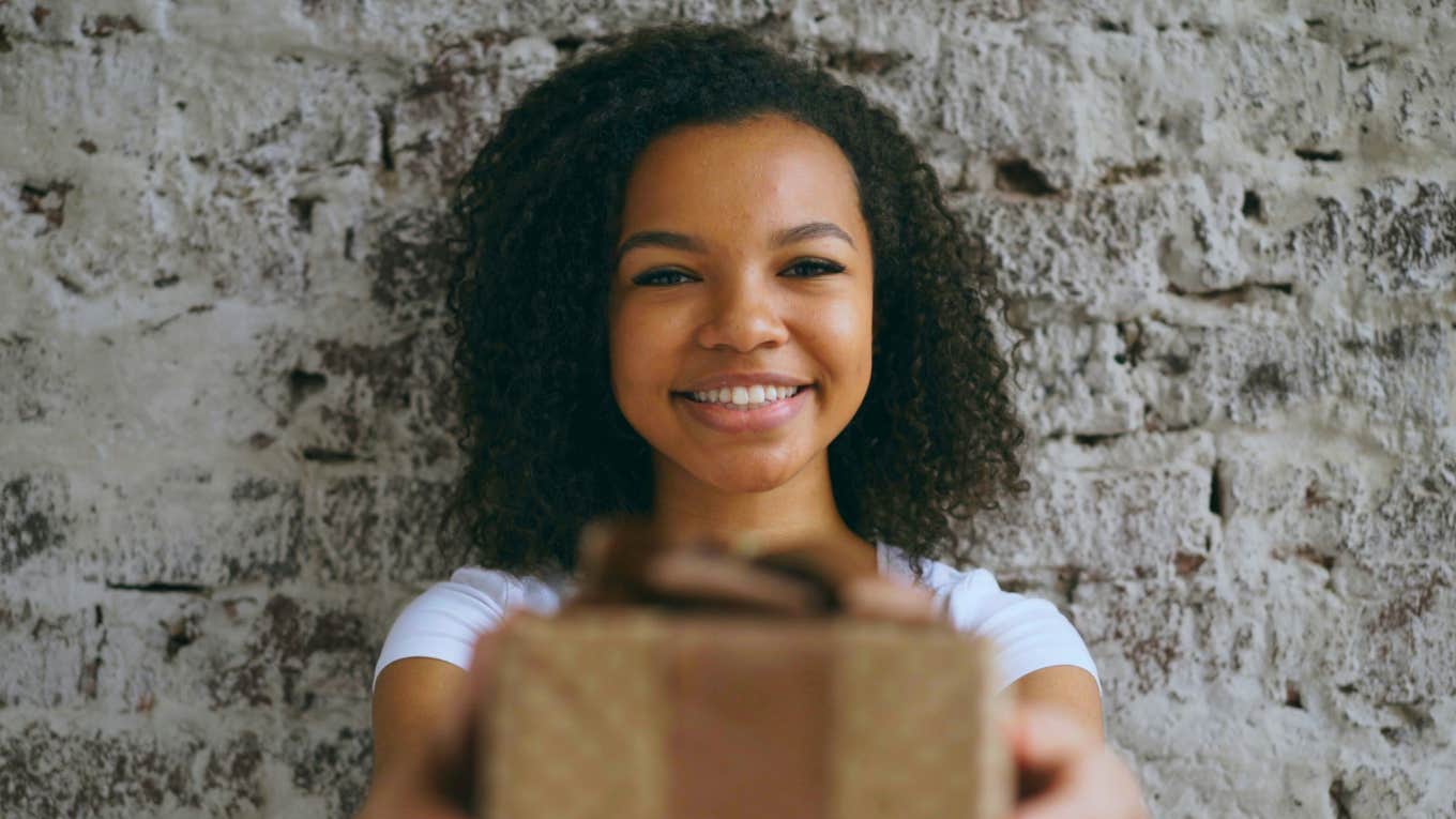 Daughter gives parents gift.