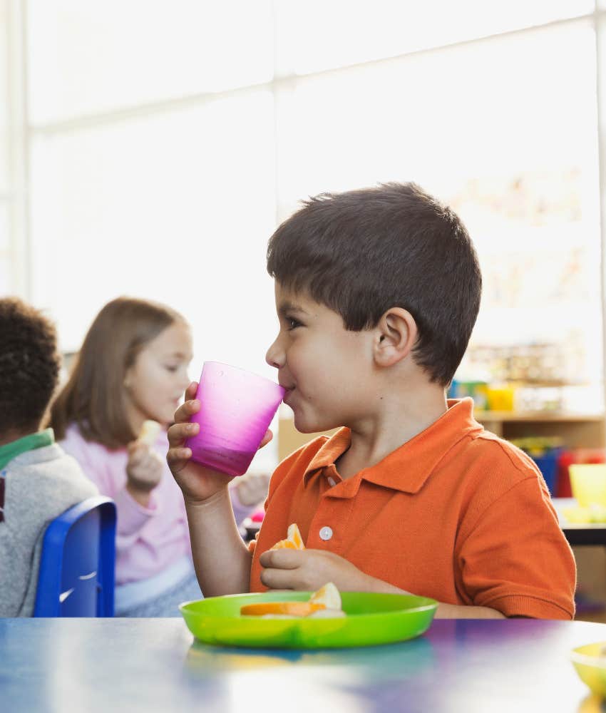 Student eating a snack he brought from home