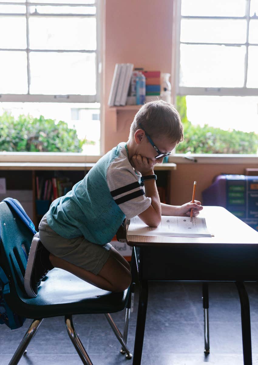 young student doing his schoolwork