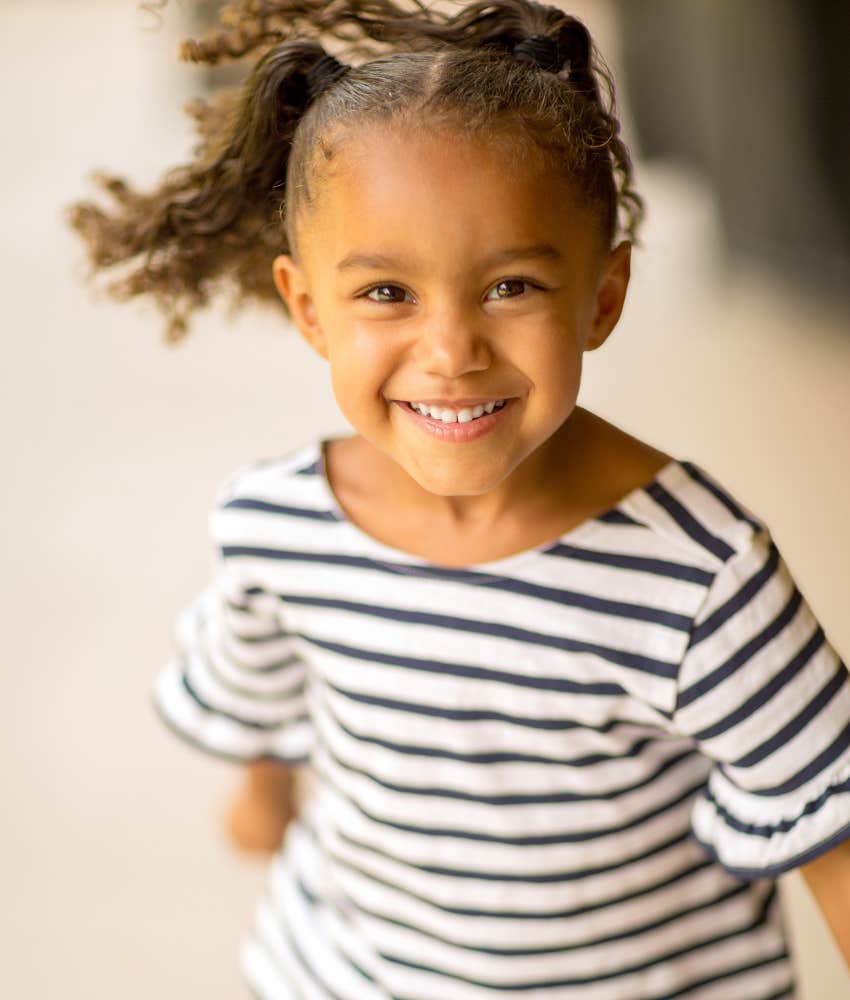 Little girl who has learned the important parenting lesson of self-love and respect