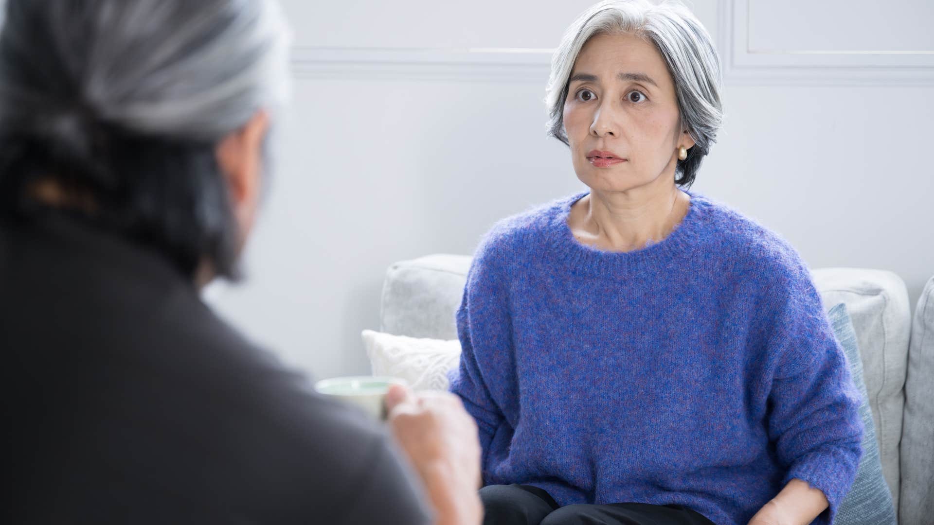 Woman who's comfortable with conflict having a serious discussion.