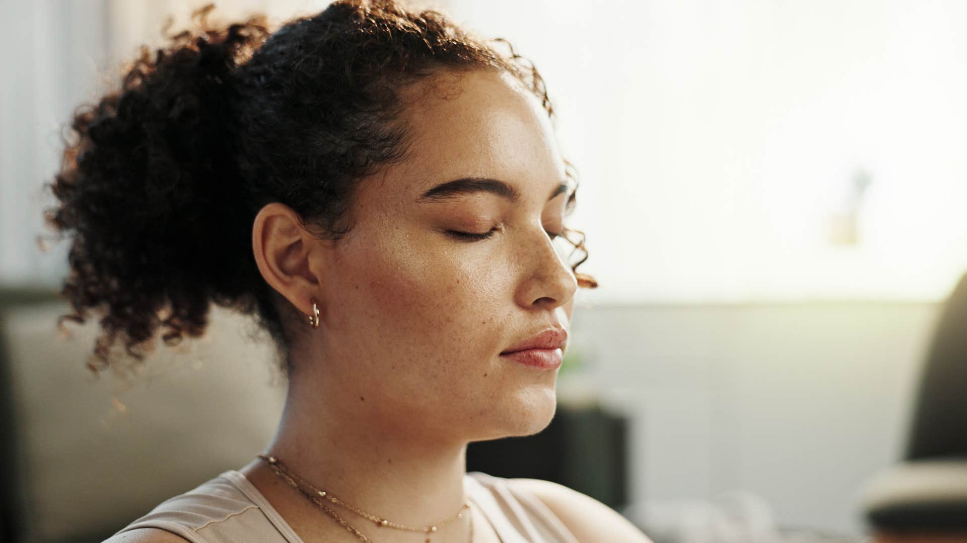 Woman with a strong intuition sitting at home.