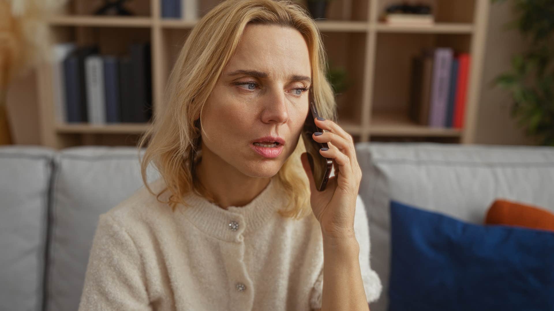 Woman who has eye for red flags talking on the phone.