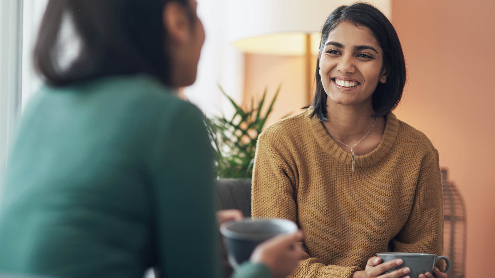 Woman who prioritizes authenticity talking to a friend.