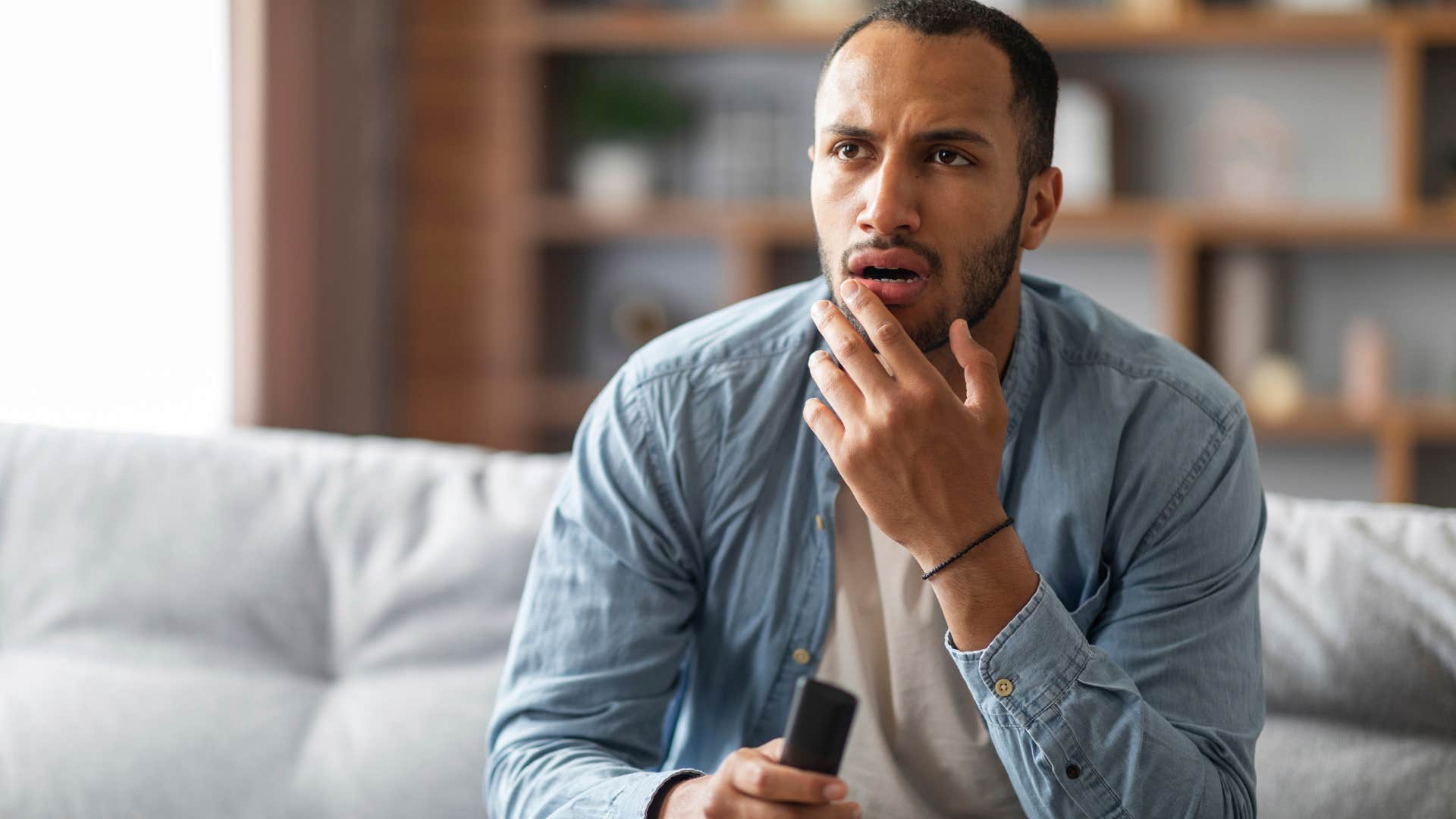 man who is remembering a dream as certain moments feel familiar