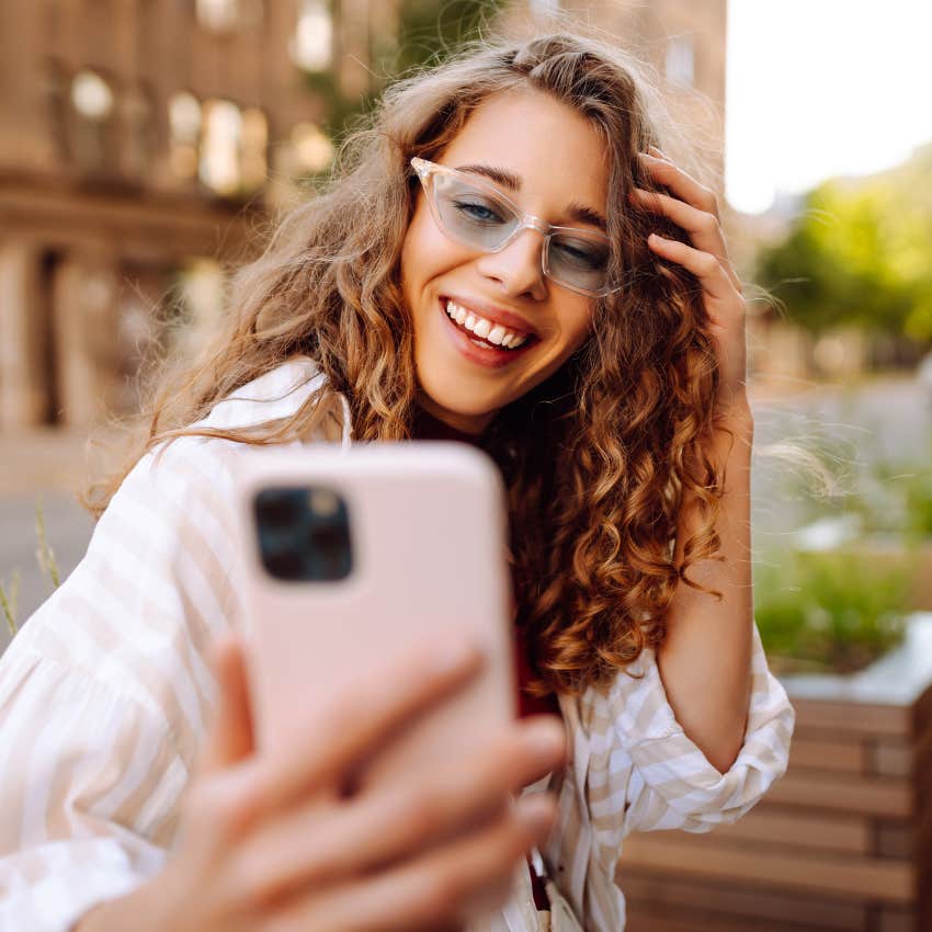 woman who is smiling with teeth that will make men swipe right