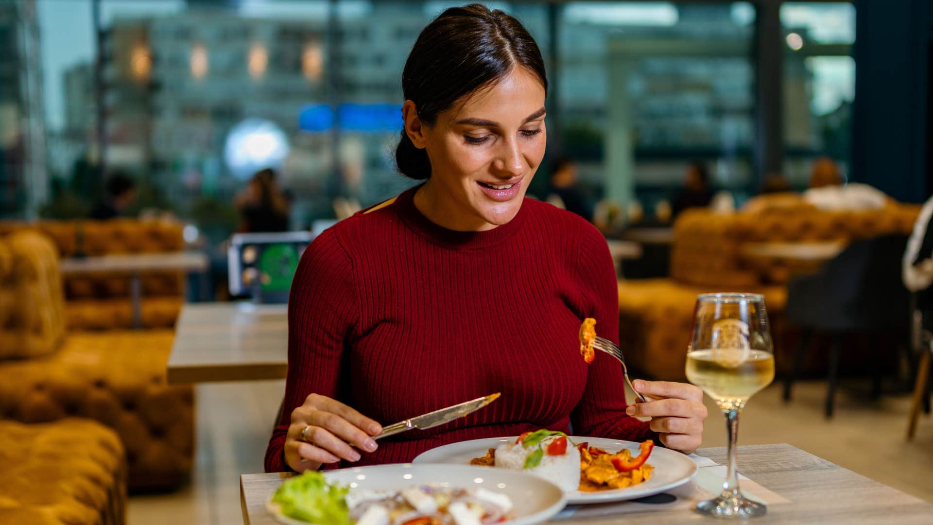 woman eating at a restaurant alone