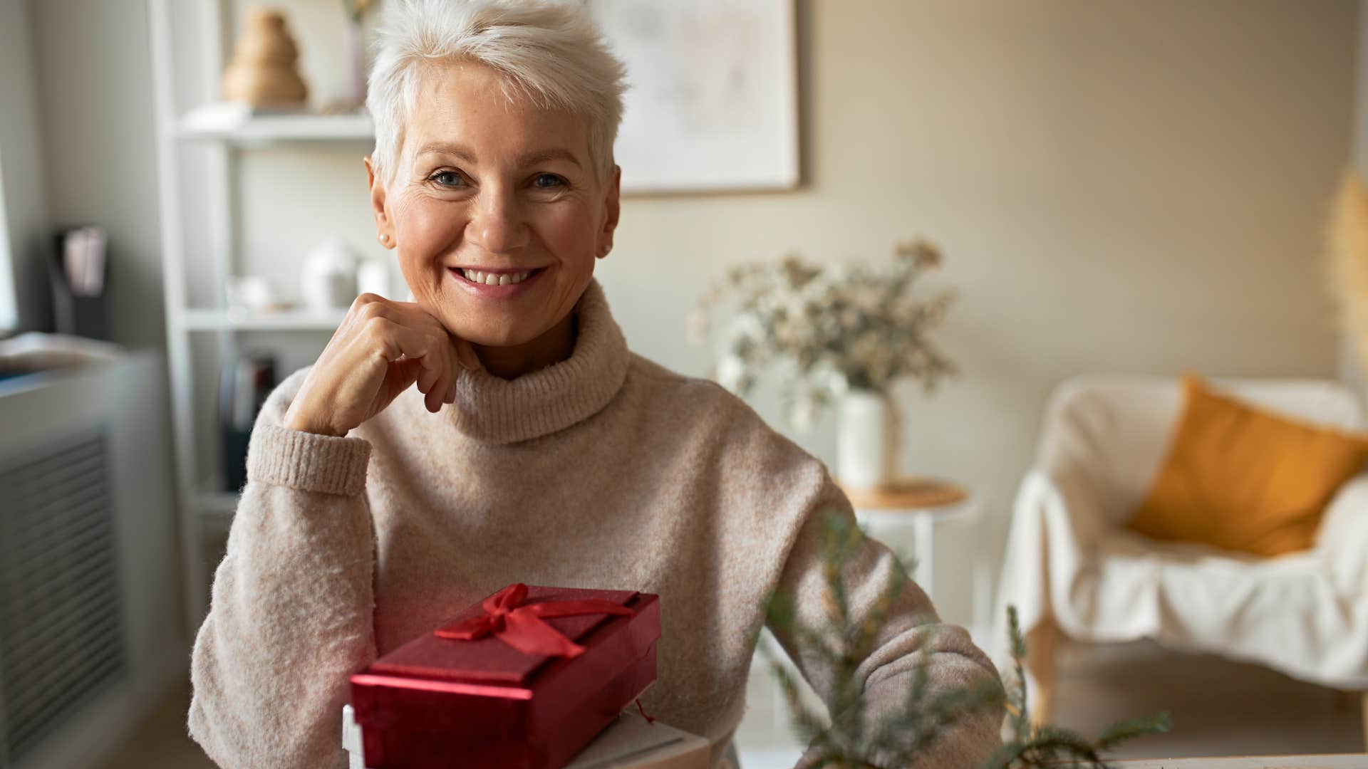 frugal woman reusing gift wrap on presents