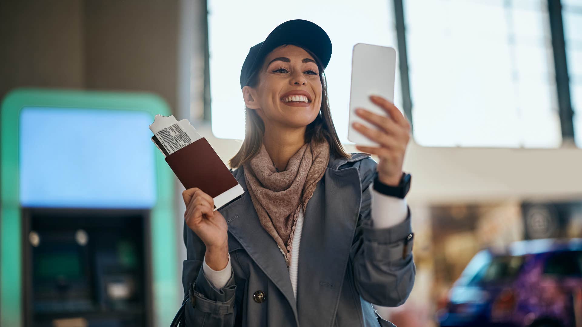 woman holding her airplane ticket