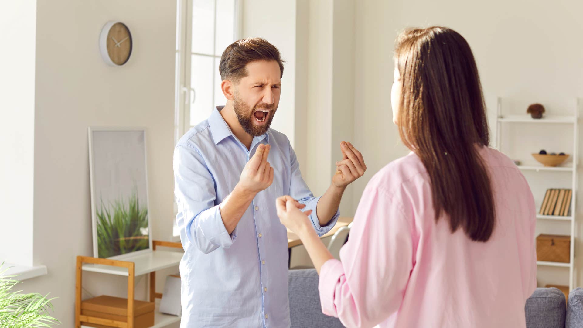 angry rude man negging woman at home