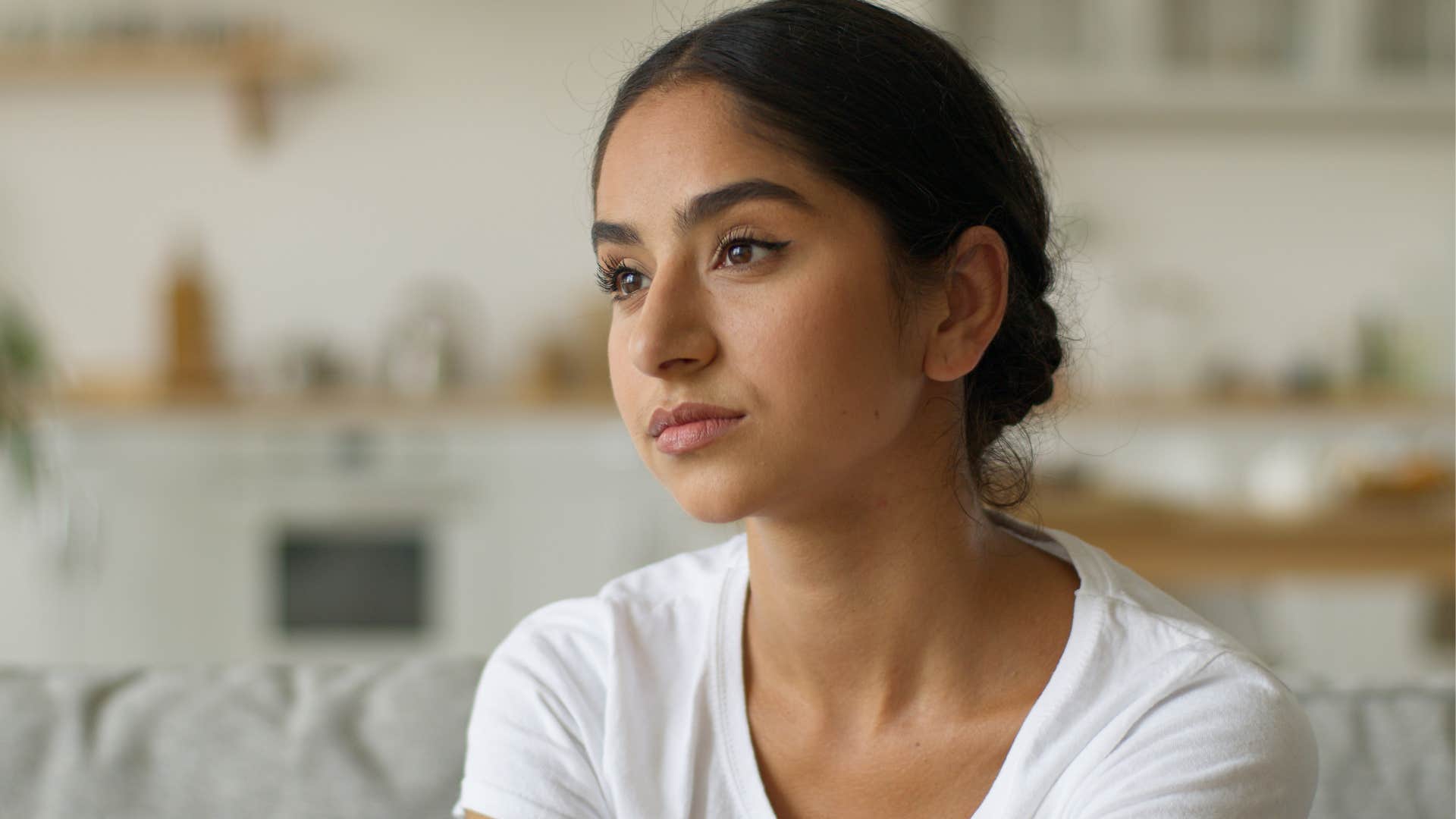 aloof woman neglecting her self-care at home